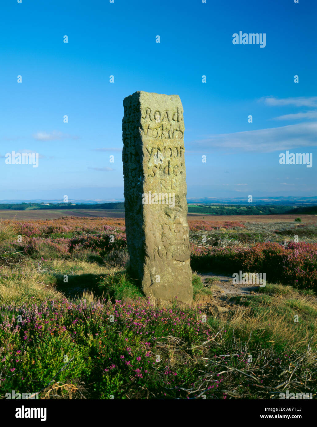Marker stone on Blakey Ridge pointing the way to Kirkbymoorside, North York Moors, North Yorkshire, England, UK. Stock Photo