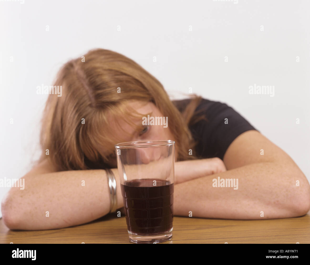 young woman taking alcohol modelled Stock Photo