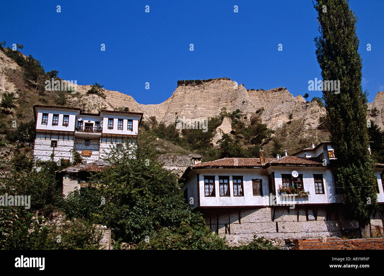 Houses in front of Sandstone pyramids, Melnik, Bulgaria Stock Photo