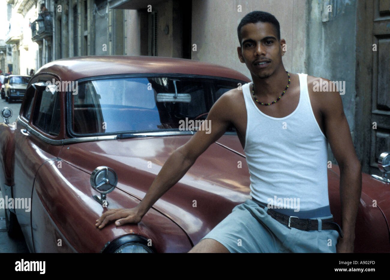 Young Man and Car Habana Vieja Havana Cuba Stock Photo