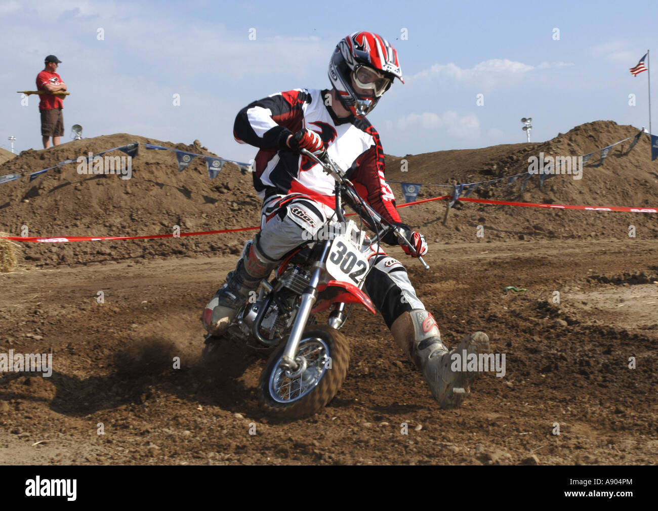 Motocross racing 15yr+ division race. Grown ups ride small 50cc motorcycles in this class. Stock Photo