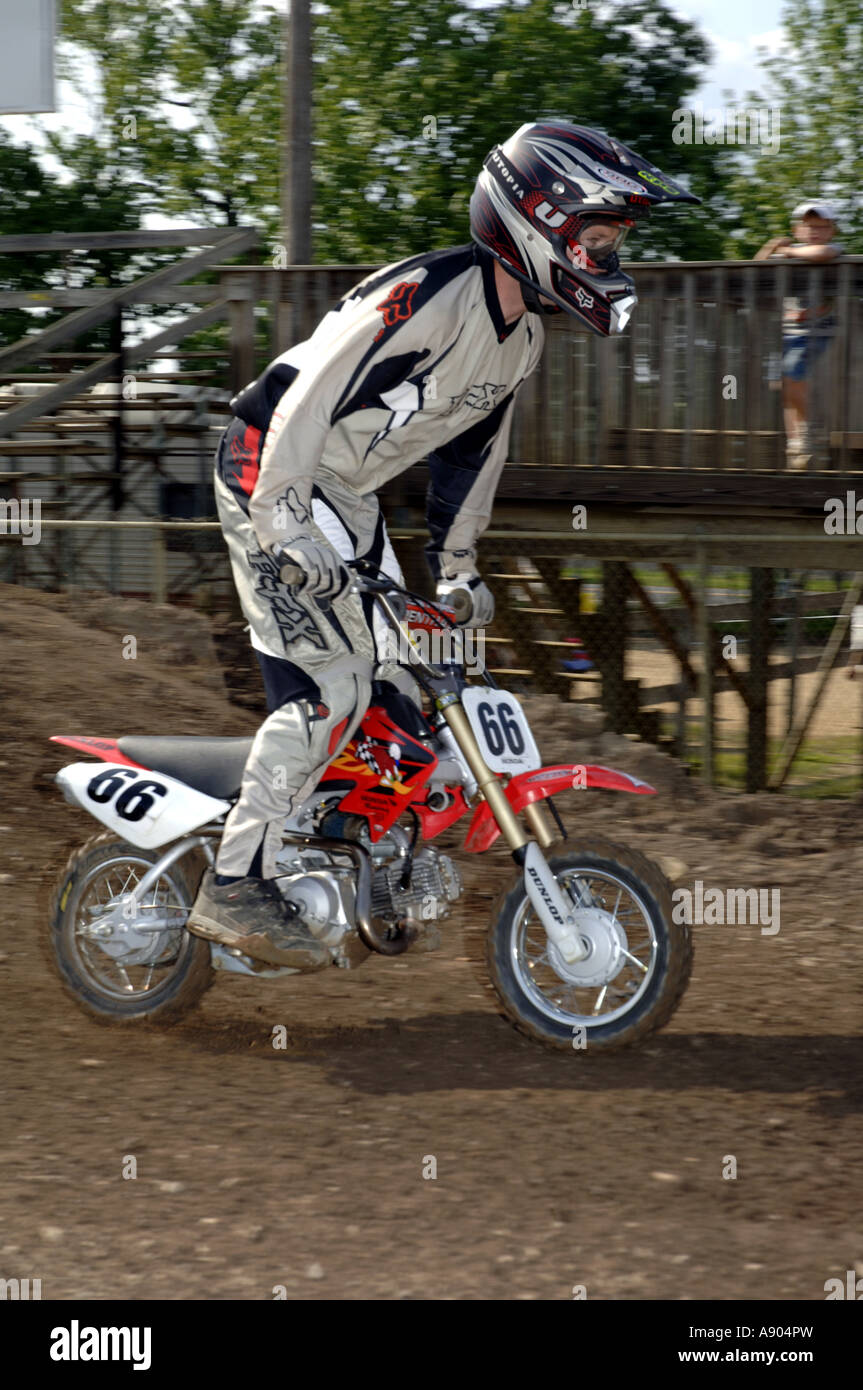 Motocross racing 15yr + division race. Grown ups ride small 50cc motorcycles in this class. Stock Photo