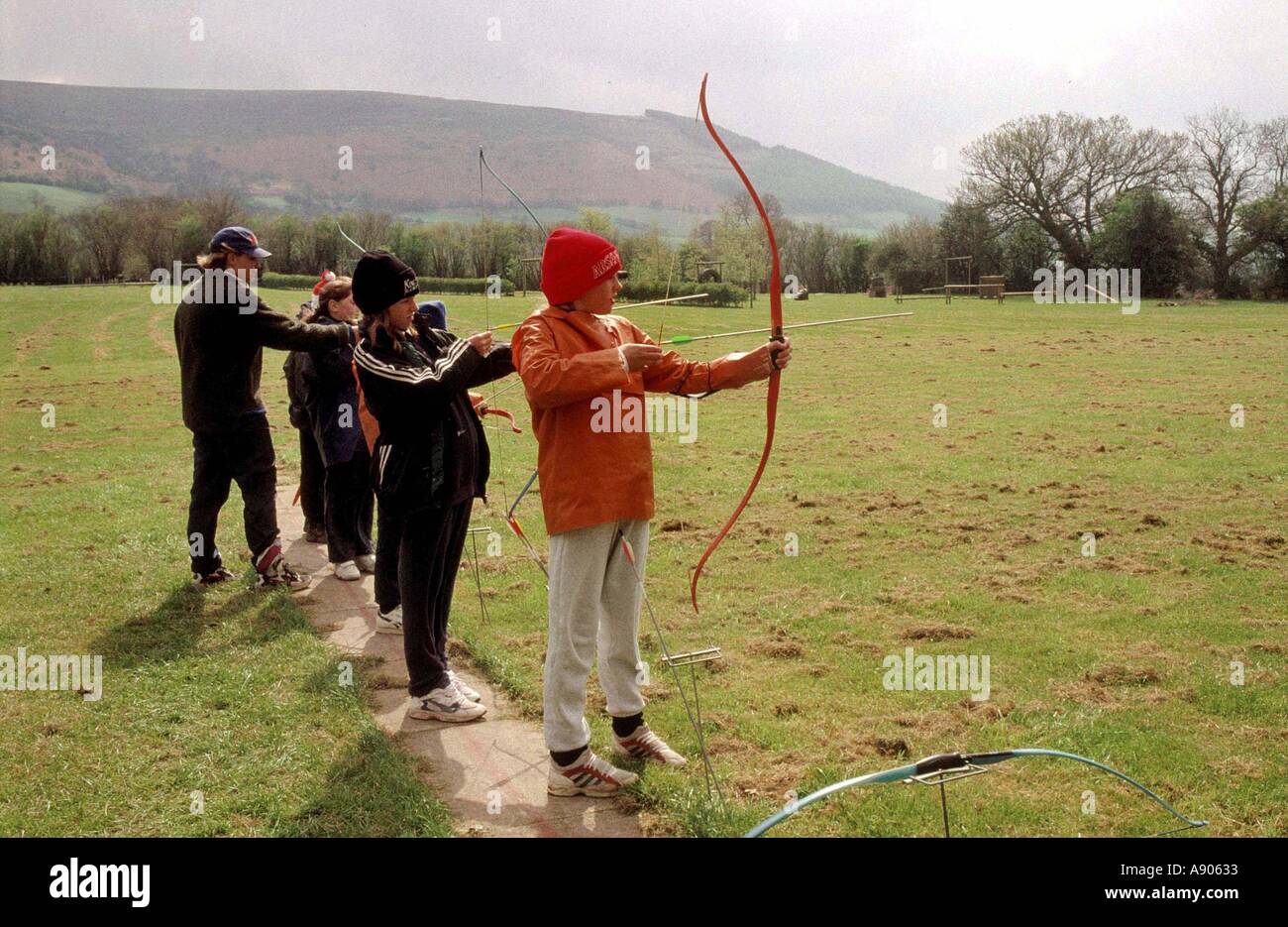 Primary school children learning archery Stock Photo Alamy