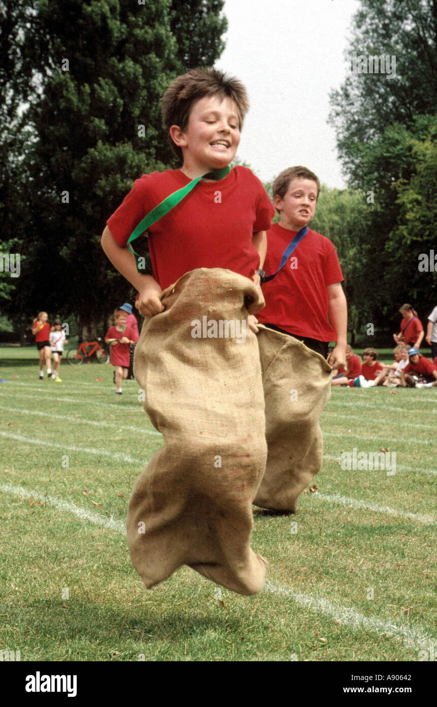 Primary school children in sack race Stock Photo