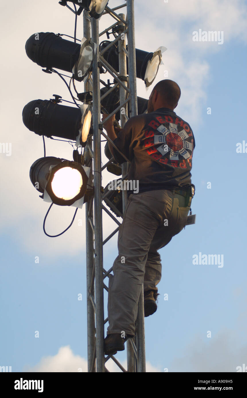 an electrician fixing the outdoor stage lighting Stock Photo Alamy