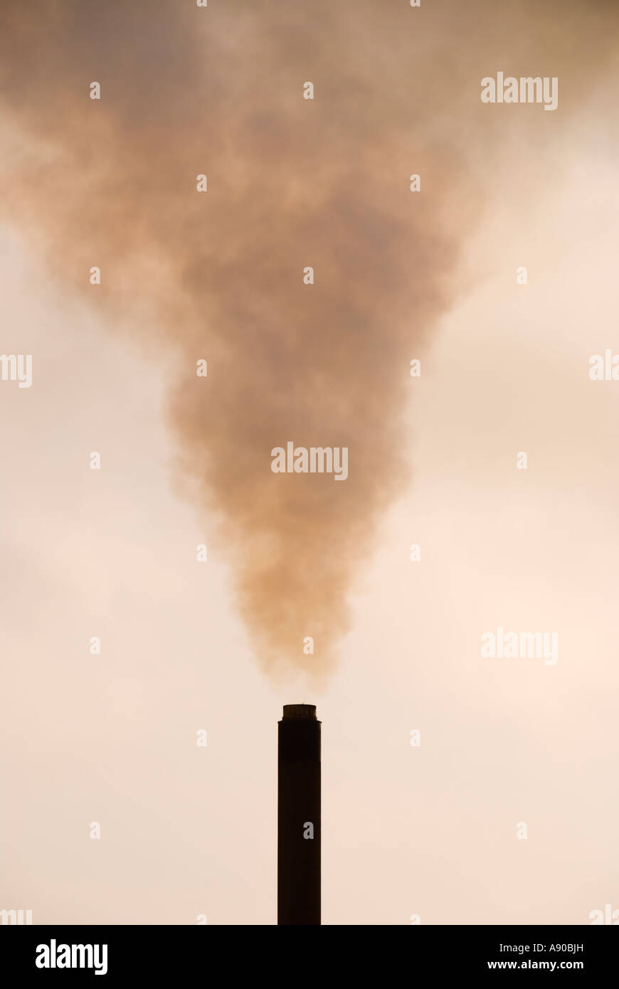 A chimney stack smoking at Port Talbot Steelworks, South Wales UK Stock Photo