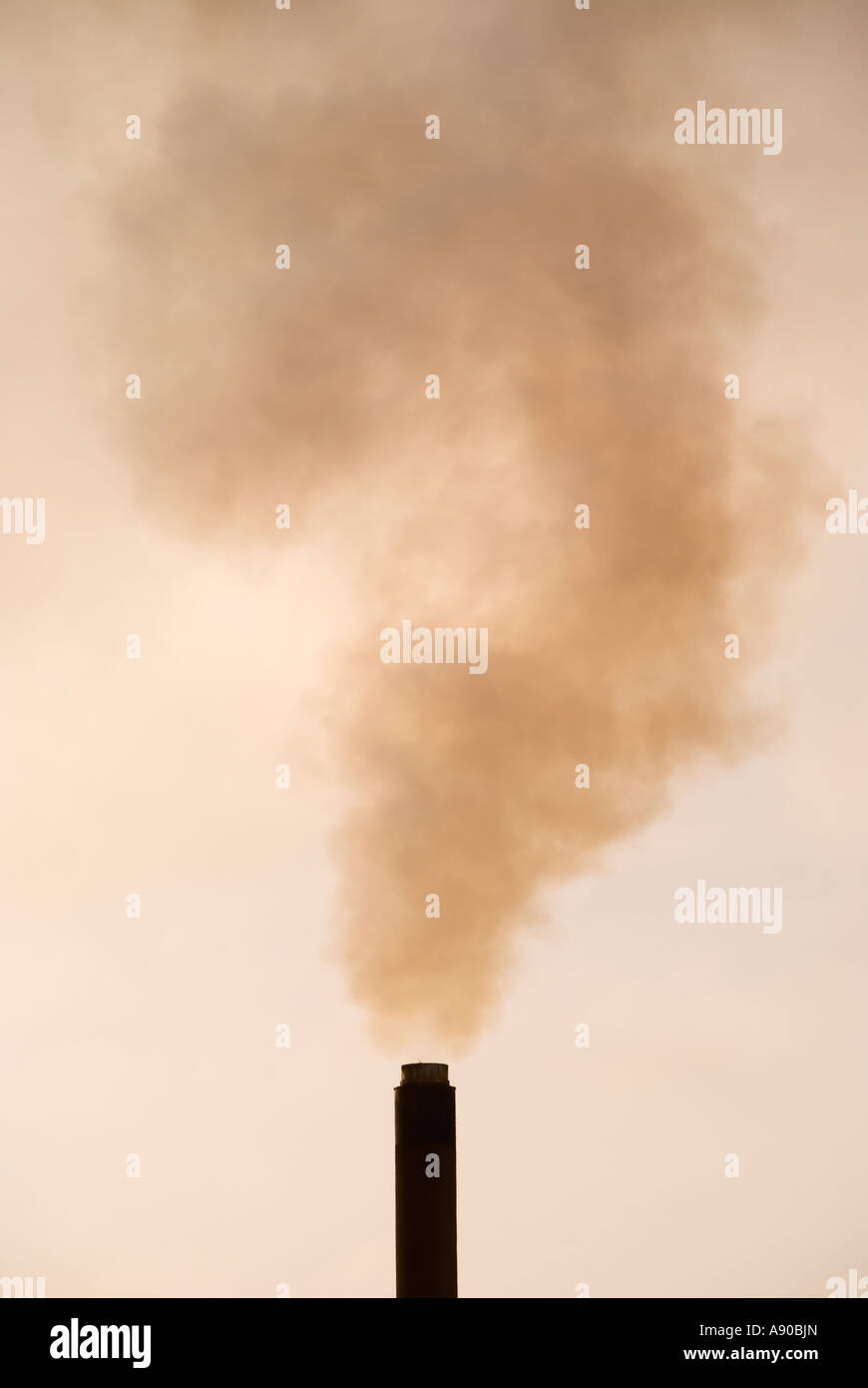 A chimney stack with smoke forming the shape of  a question mark - Port Talbot Steelworks, South Wales UK Stock Photo