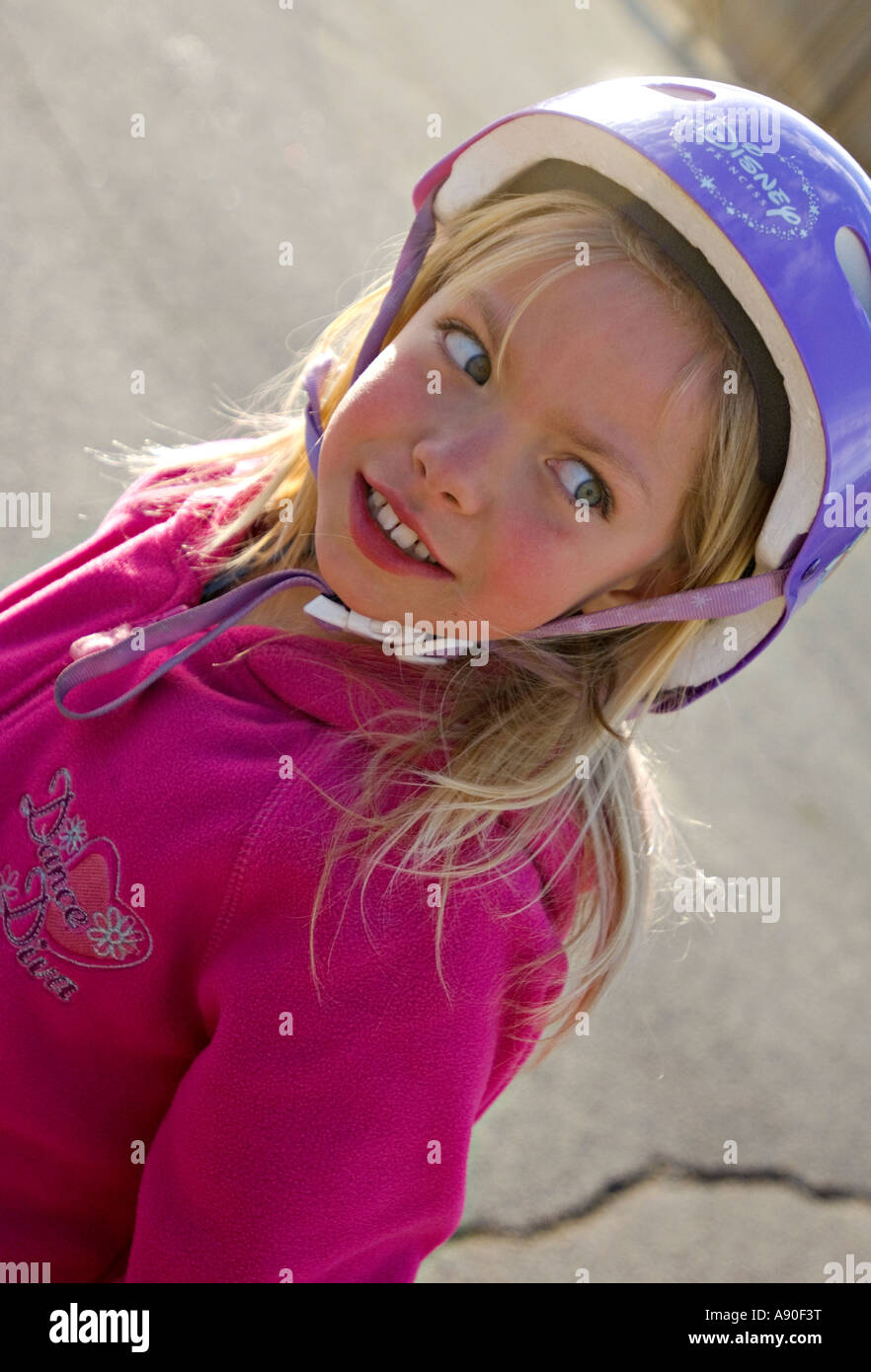 A close up portrait of a smiling young girl playing outdoors Stock ...