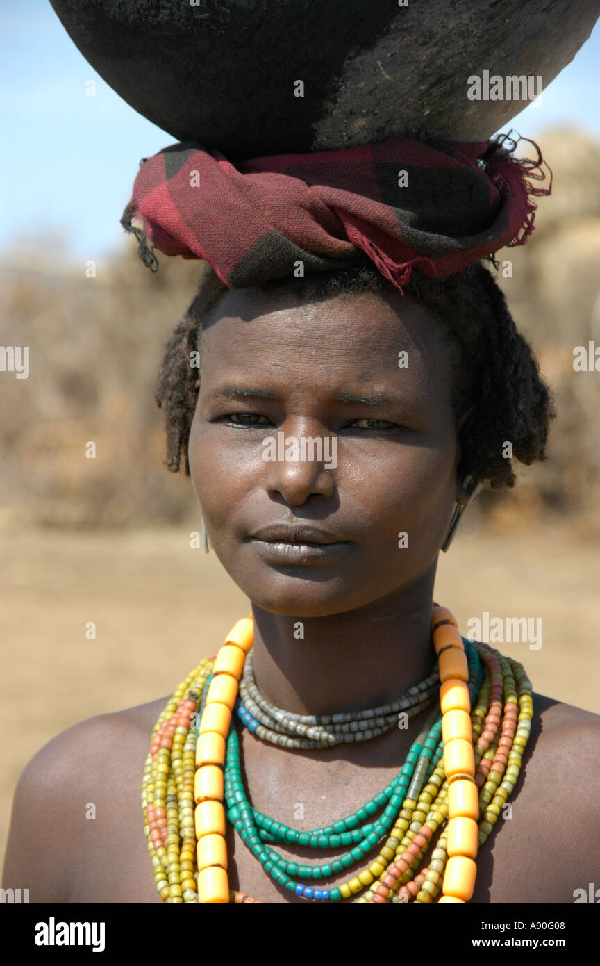 Young woman of the Dashedesh people with a pot on her head Omo River Ethiopia Stock Photo