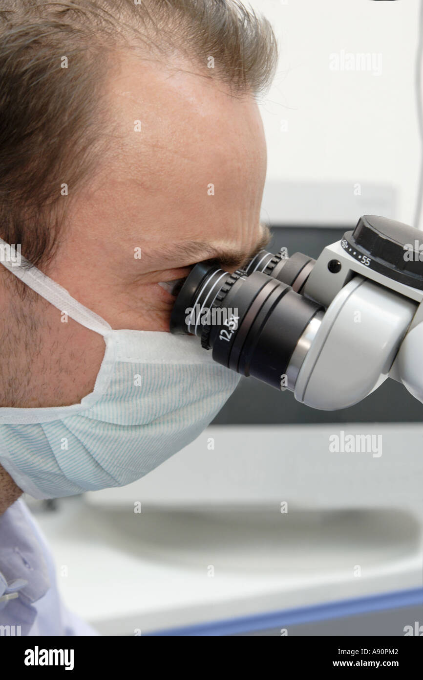 Dentist with microscope - Zahnarzt mit Mikroskop Stock Photo
