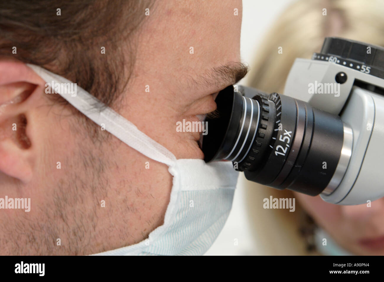 Dentist with microscope - Zahnarzt mit Mikroskop Stock Photo