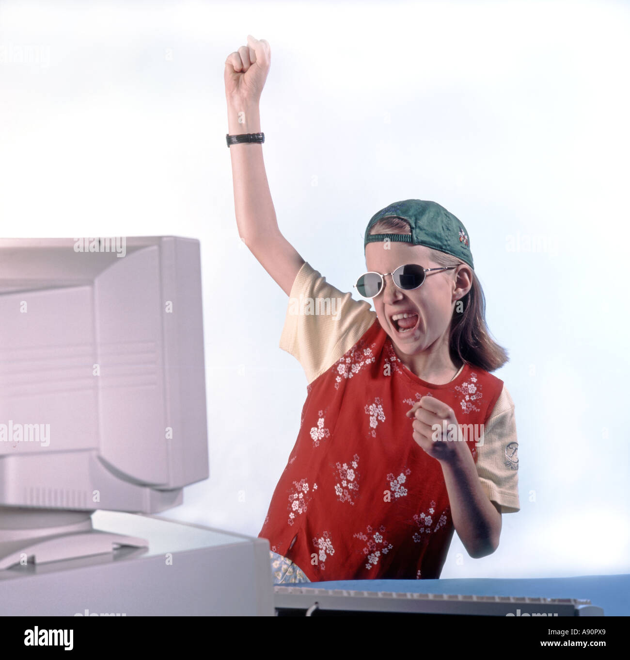 Home computer girl playing joy fun Stock Photo