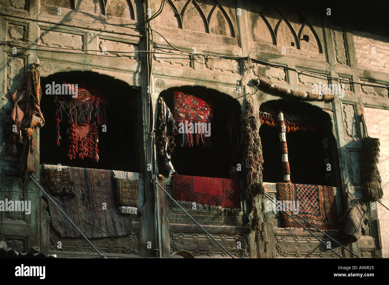 Pakistan NWFP Peshawar Old carpets and hangings outside shop Stock Photo