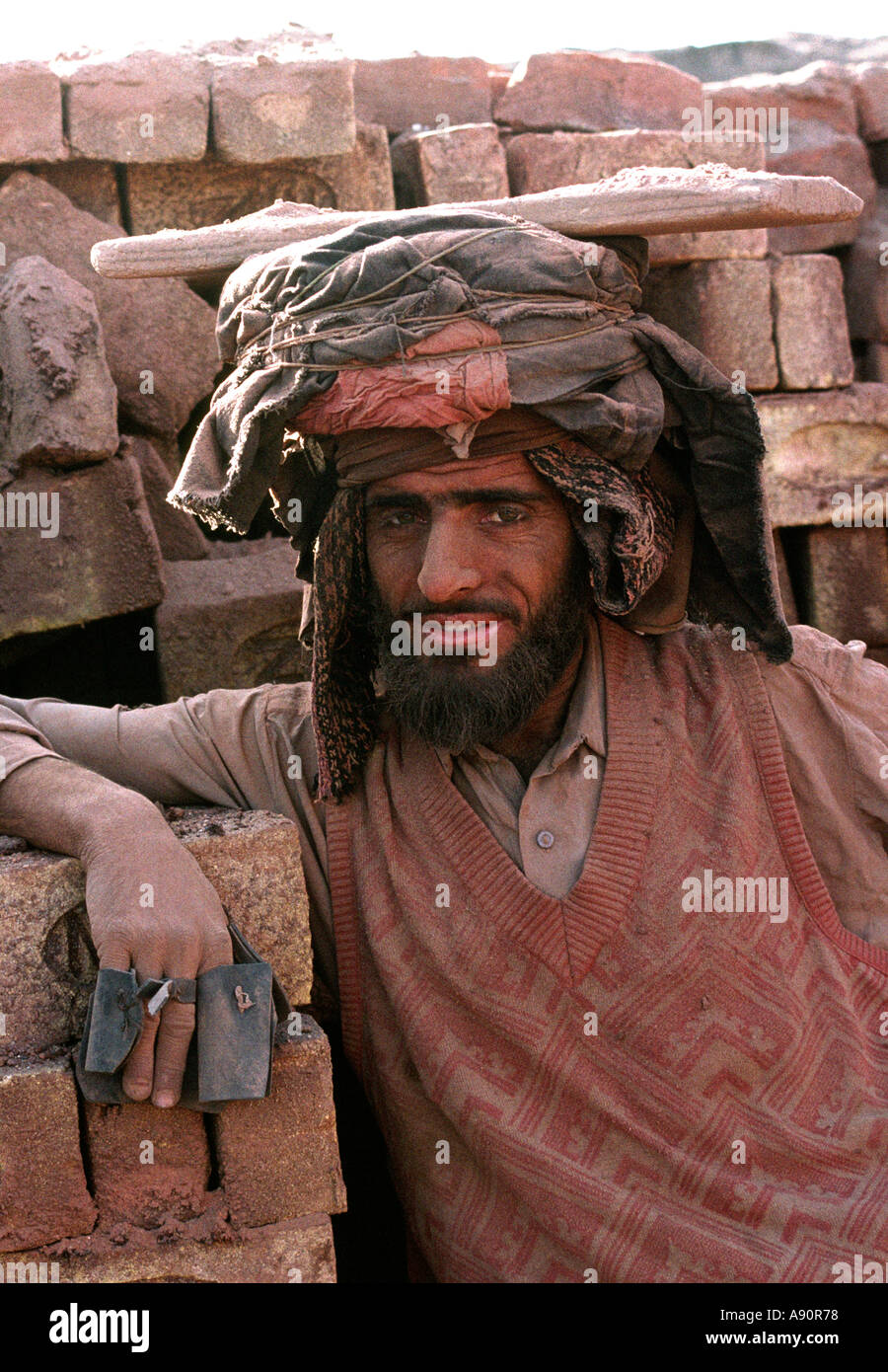 Pakistan NWFP dust covered face of worker at brickworks near Peshawar Stock Photo