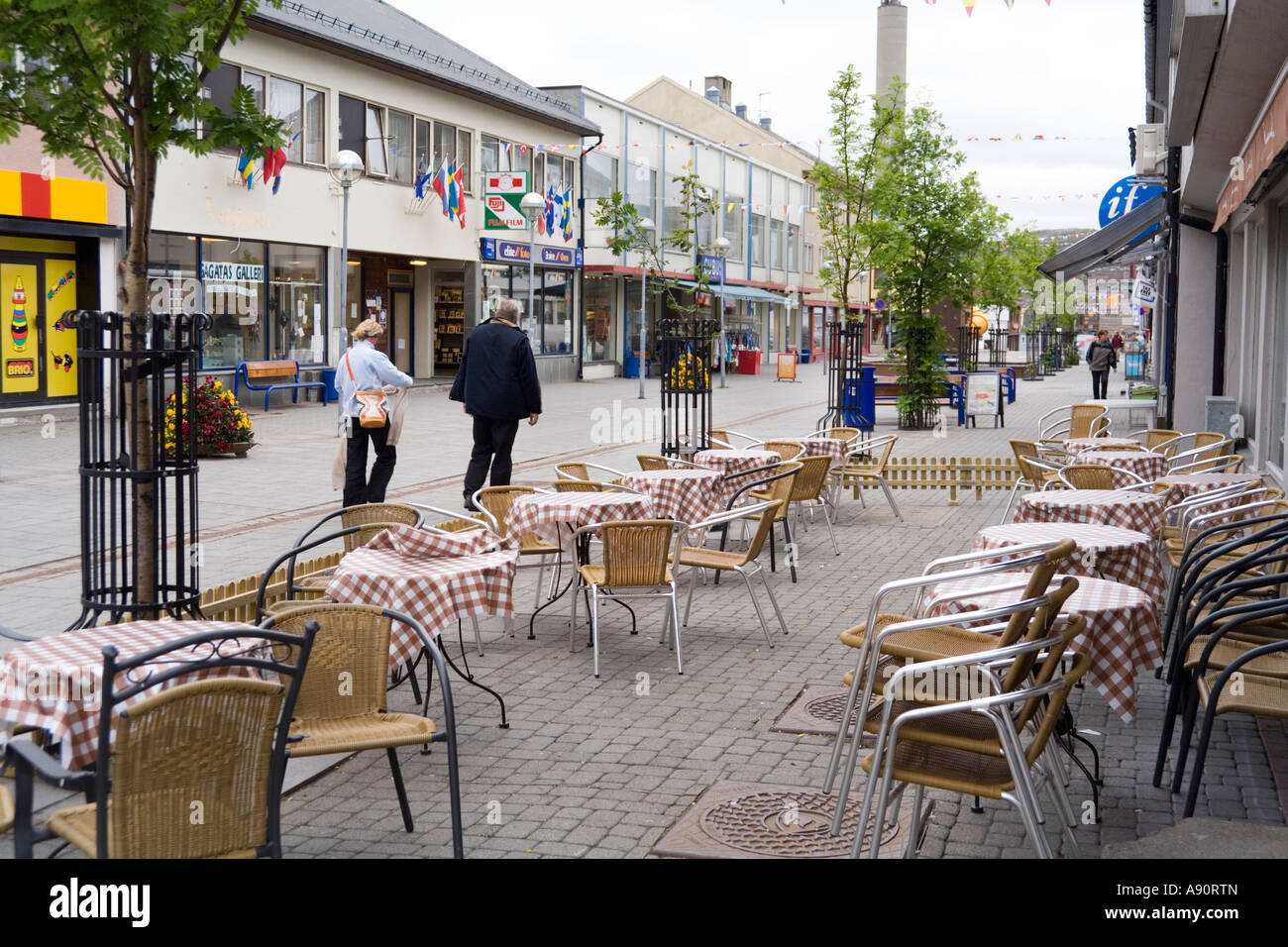 Unoccupied outdoor tables in July at a cafe 69 deg North at Kirkenes, Norway Stock Photo