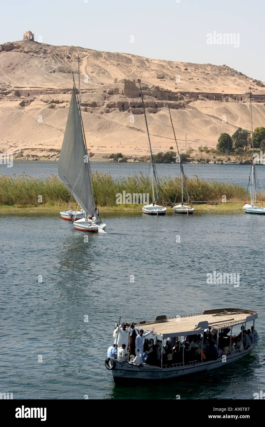 Tombs of the Nobles felucca boats on the Nile River Aswan Upper Egypt ...