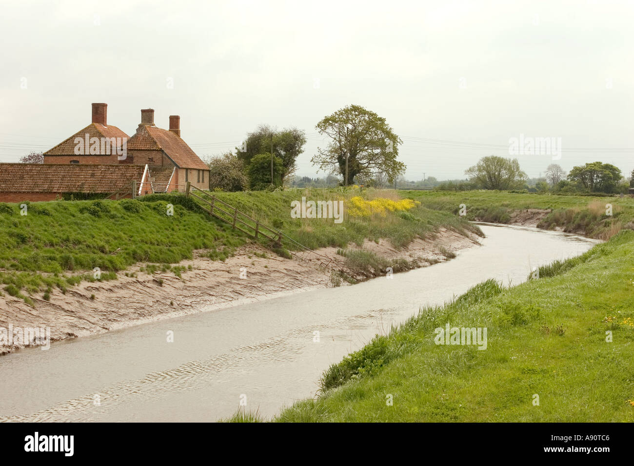 England Somerset Westonzoyland River Parrett passing remote farm Stock