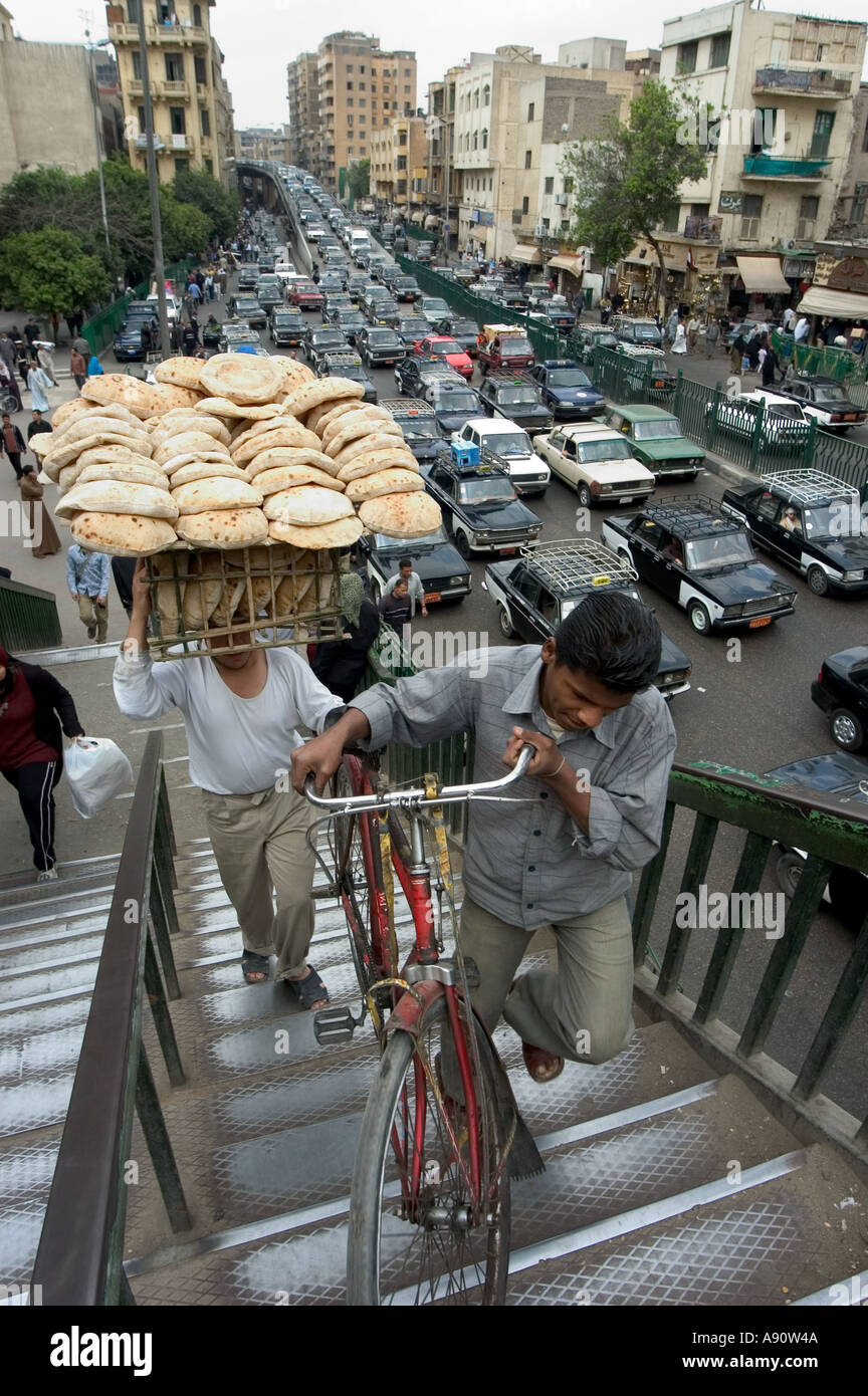 bicycle bread delivery heavy traffic street scene Islamic Cairo Cairo