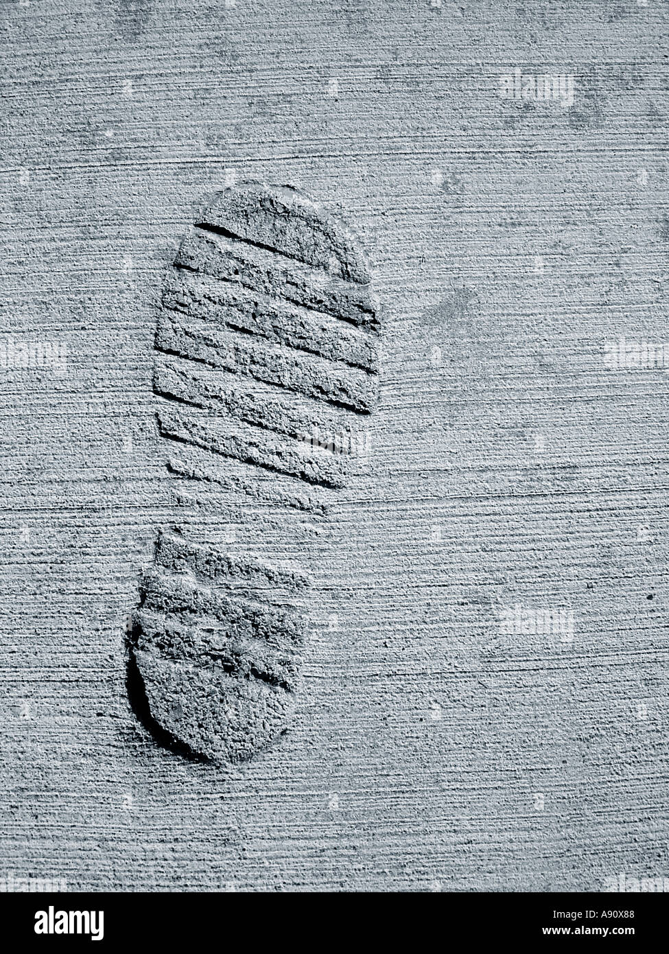 Urban Scene of Boot Print in Cement Viewed From Above Copy Space Stock Photo