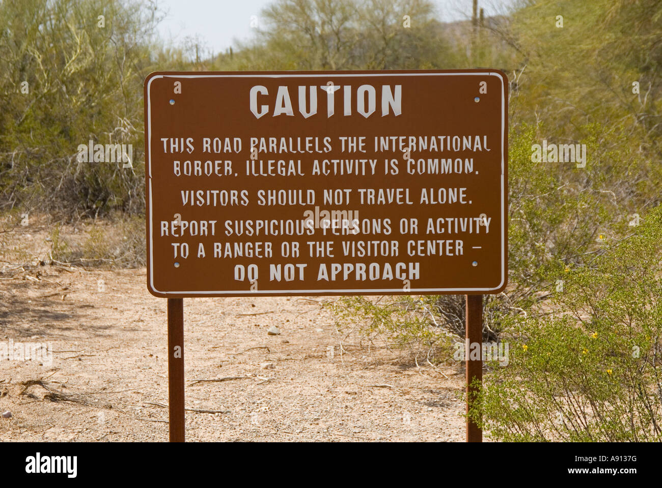 Caution warning signs, near International border, Lukeville, Arizona,USA, near Mexican border. Stock Photo