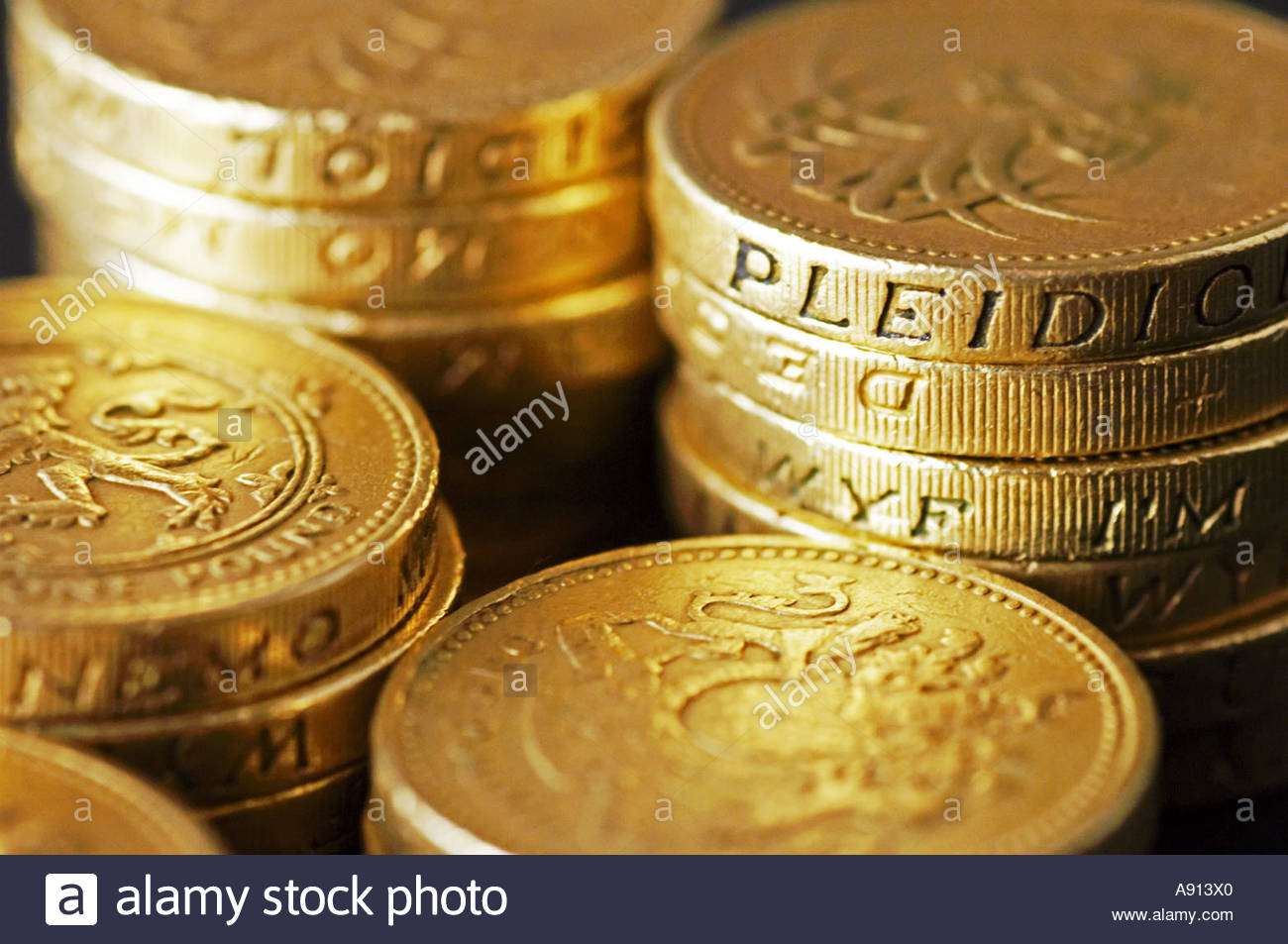 A stack of old style UK Pound Coins Stock Photo