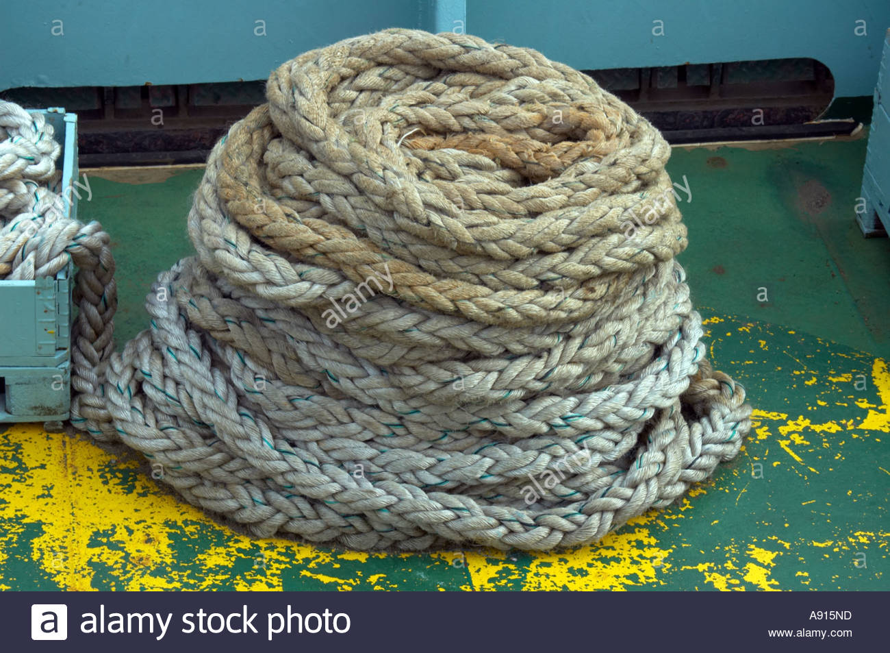 A coil of rope on a ships deck Stock Photo - Alamy