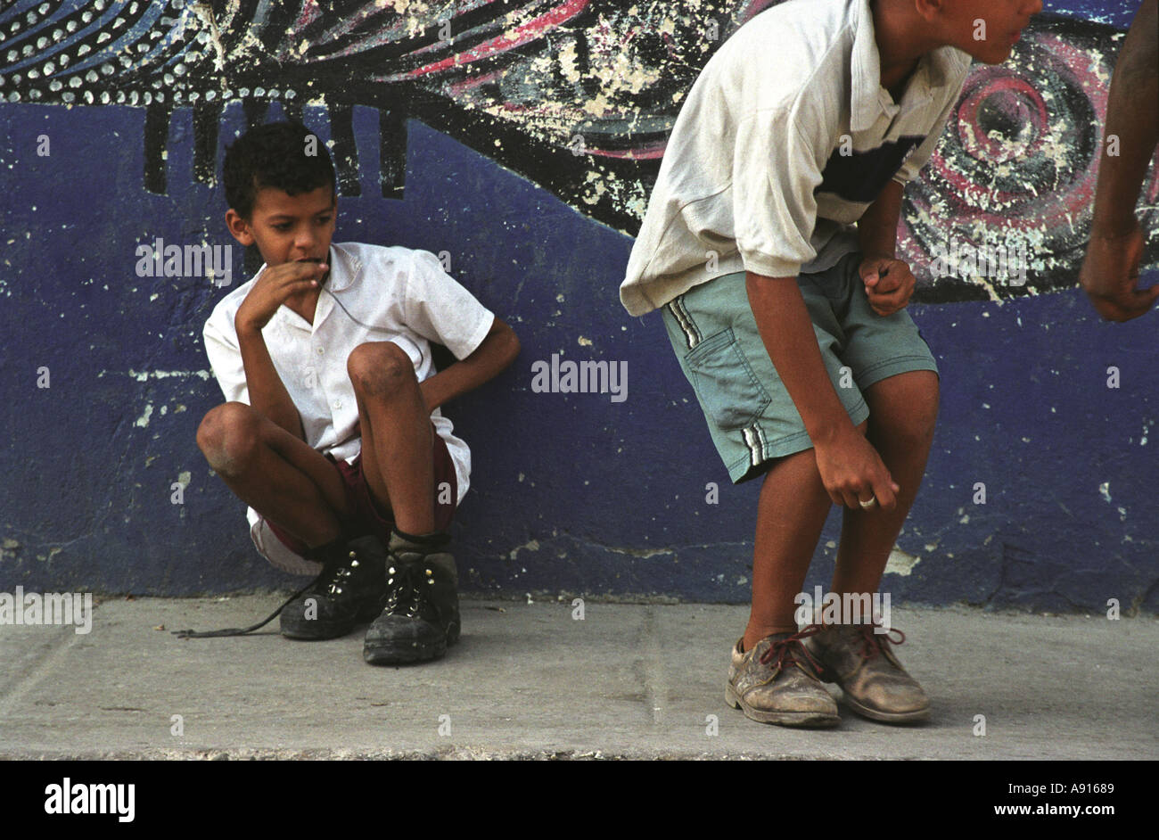 Cuban boys playing marbles in calle jon de hamel havana Stock Photo