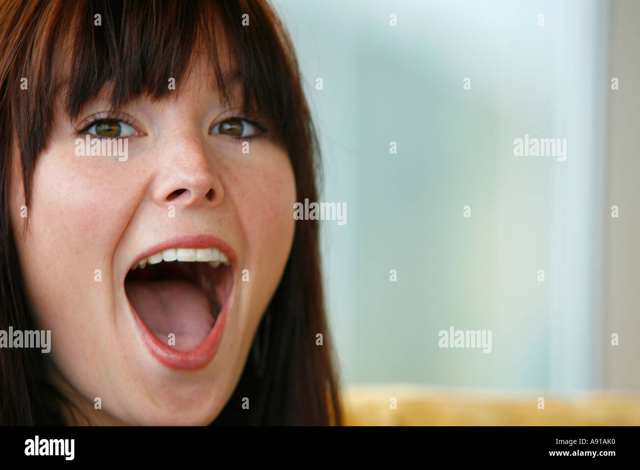 A look of open mouthed surprise on a young woman s face Stock Photo Alamy