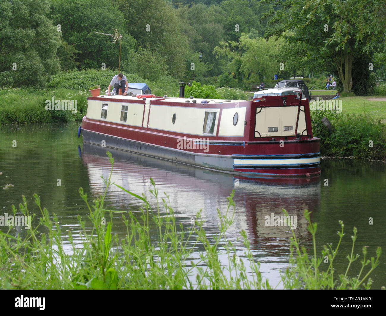 A narrow boat or barge on peaceful canal Stock Photo - Alamy