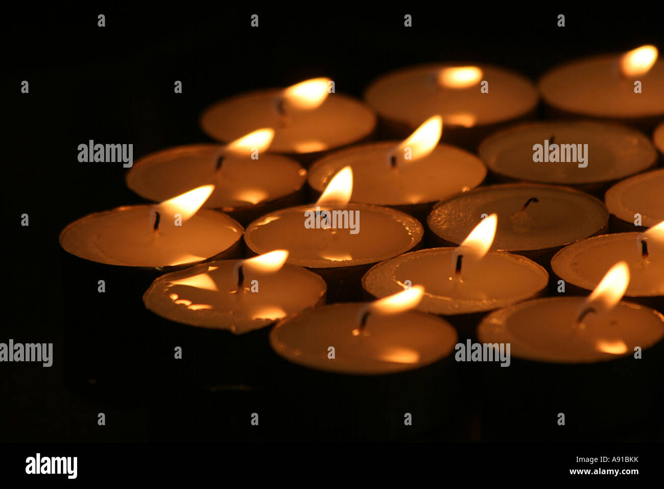 A collection of tealights burning Stock Photo Alamy