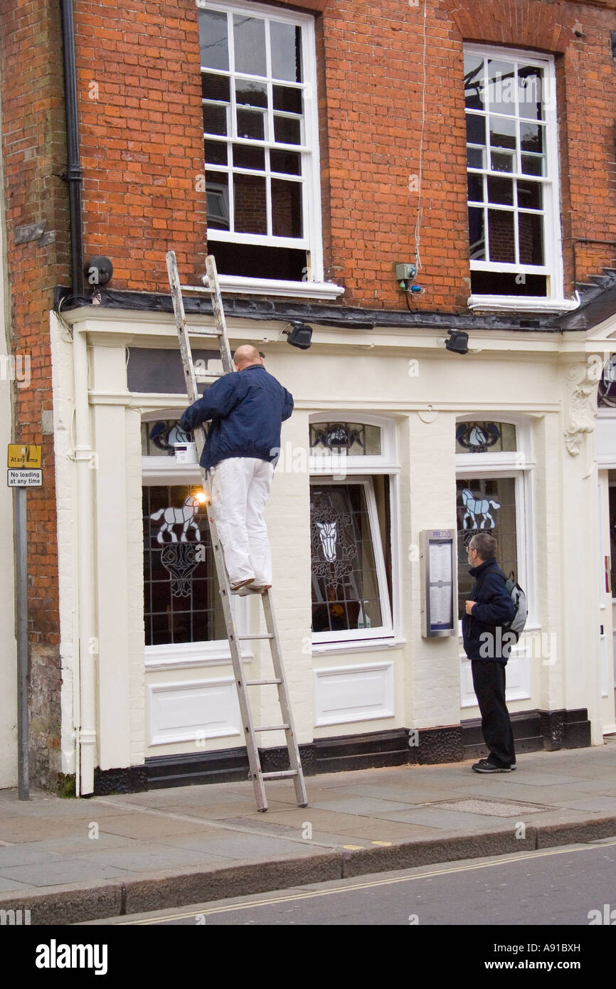 Painting a building up a ladder hi-res stock photography and images - Alamy
