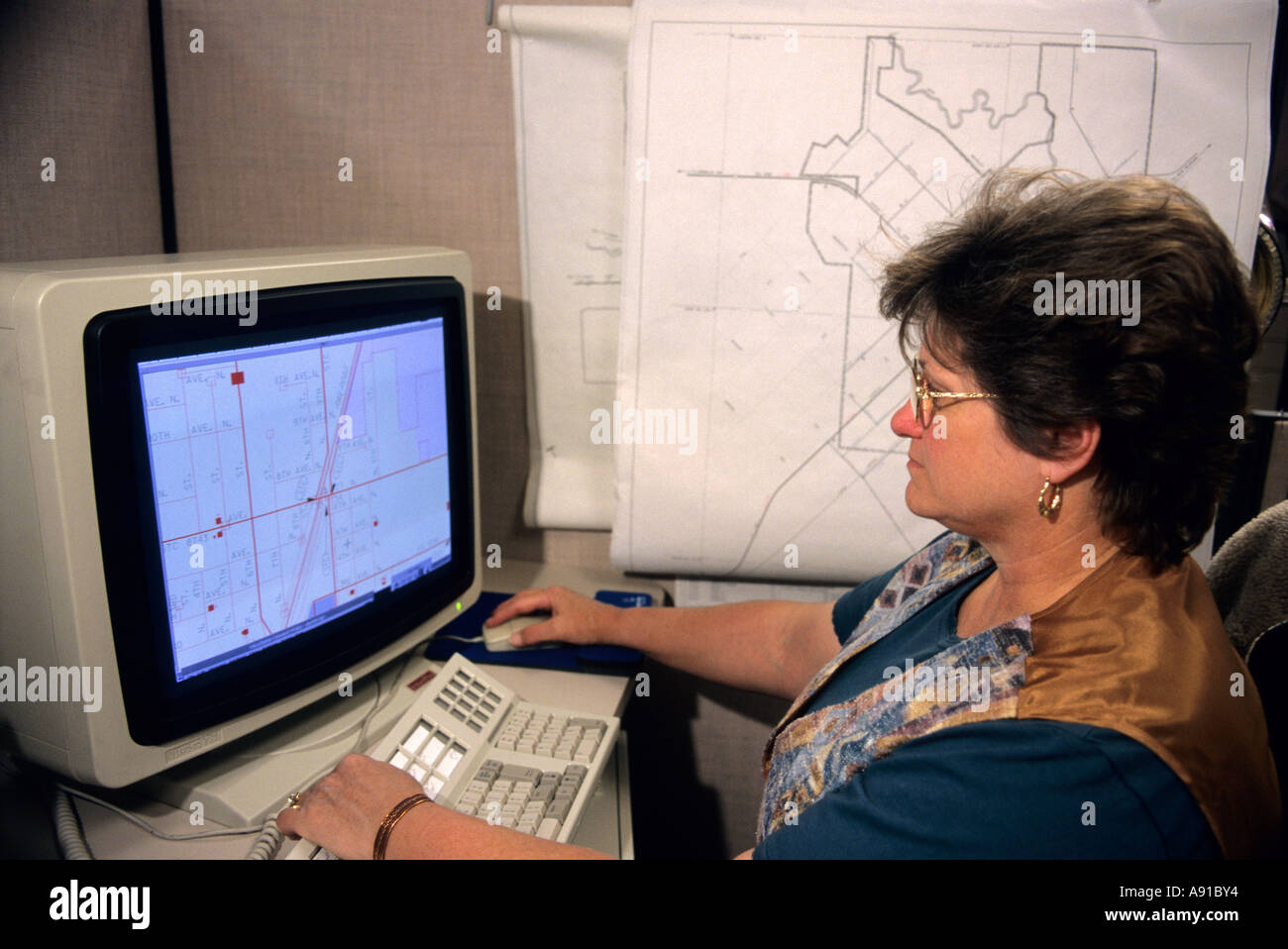 Cartographer, highway department map maker using a computer in Boise, Idaho. Stock Photo