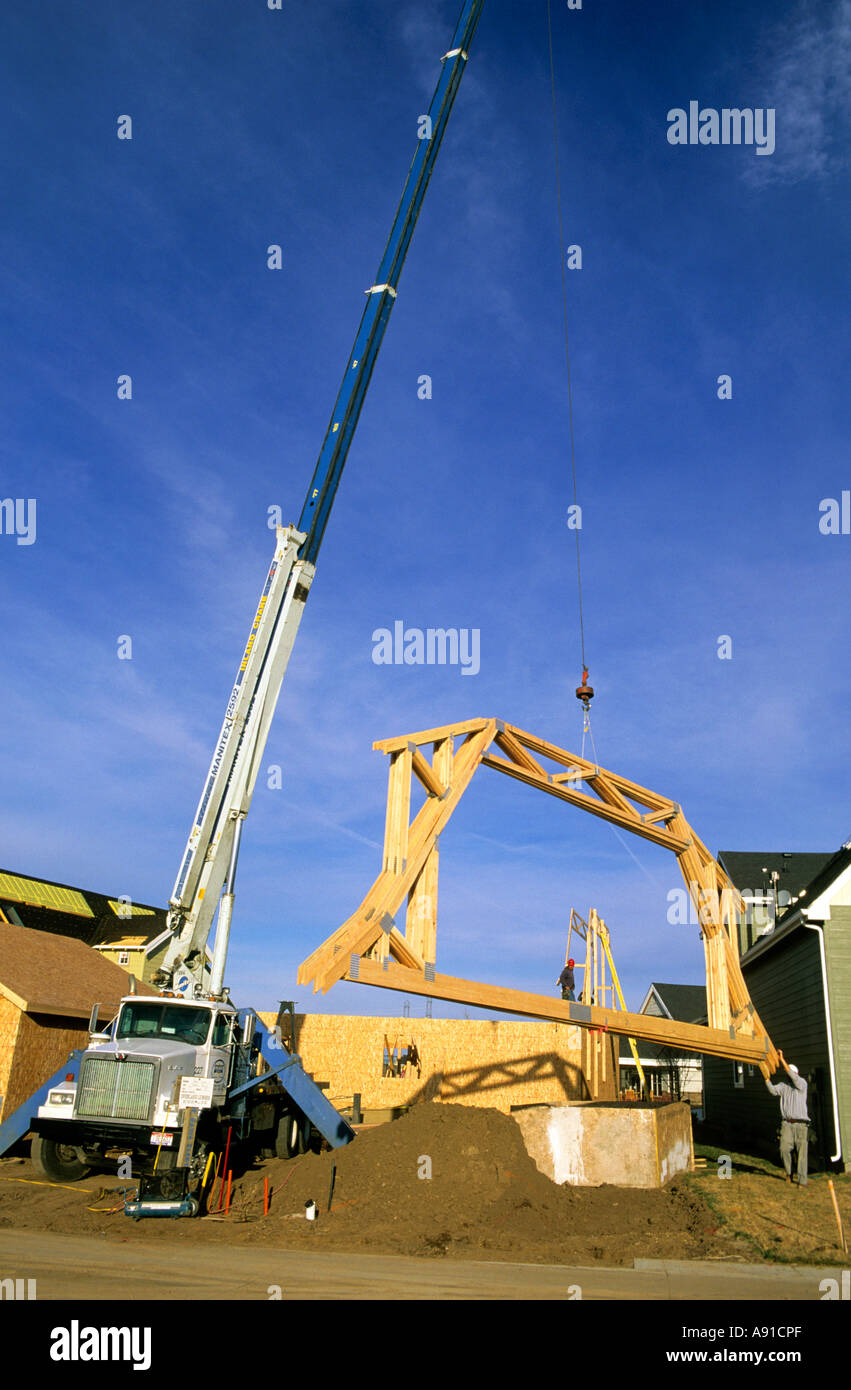 Truck mounted crane delivering trusses in Boise, Idaho Stock Photo Alamy
