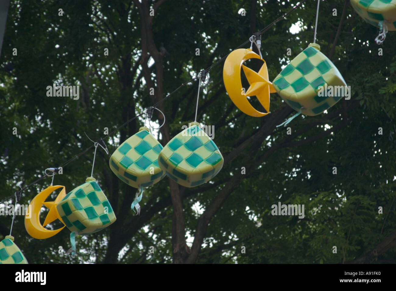 decorations hanging above a malaysian street to celebrate hari ...