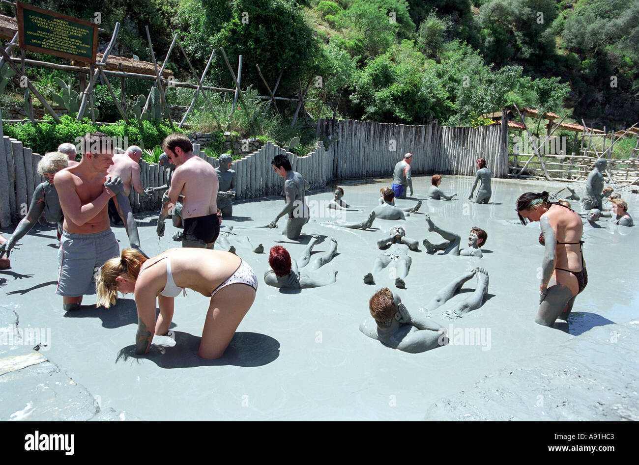 Tourists enjoy the Mud Baths at Dalyan in Turkey Stock Photo