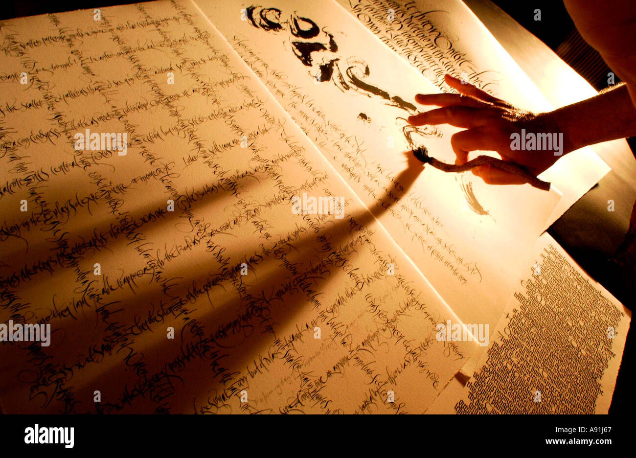 Calligraphy performed by a master craftsman and artist with  oriental brush and ink Stock Photo