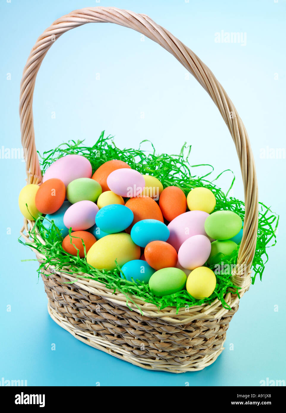 COLOURED EASTER EGGS IN BASKET Stock Photo Alamy