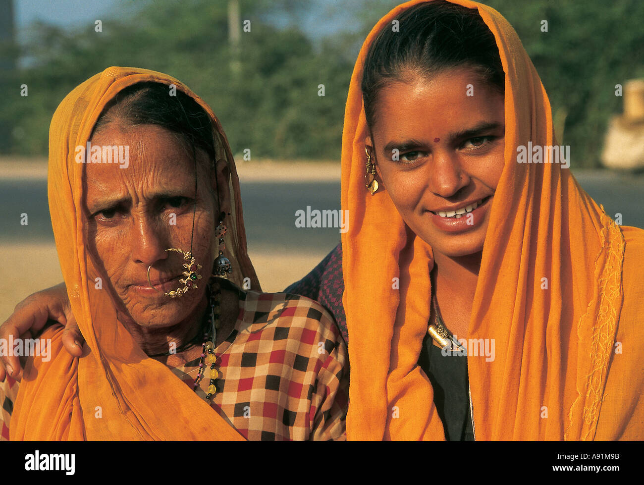 NMJ99778 Mother Daughter Smiling Happy Rajasthan India Stock Photo