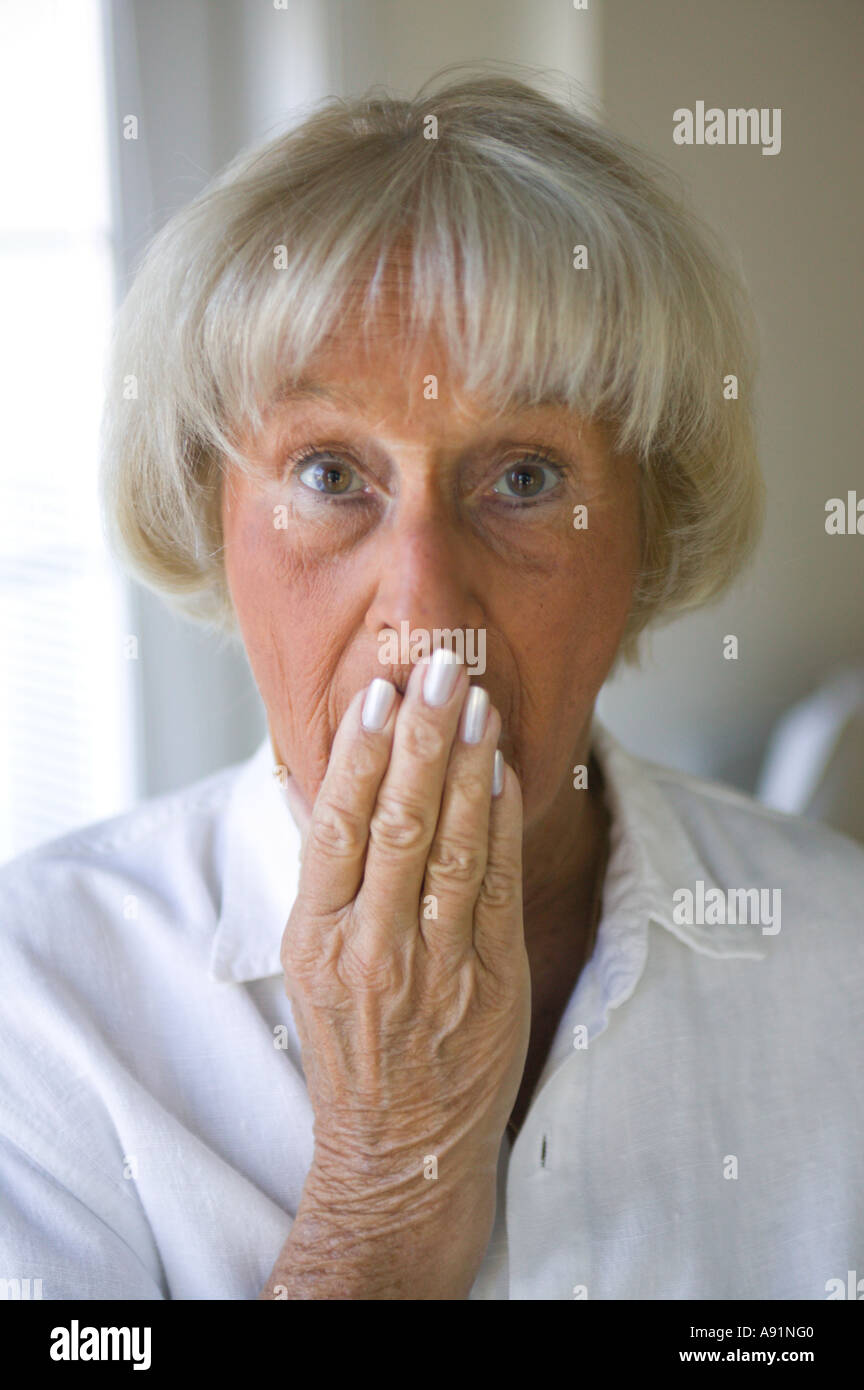 Senior Woman acting surprised Stock Photo