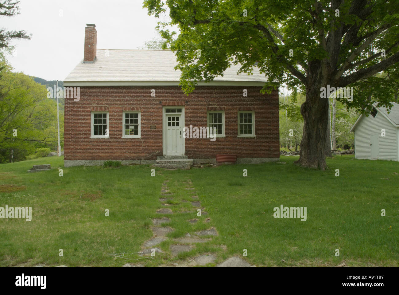 Brickett Place in Stow Maine USA.19th century historic brick farmhouse