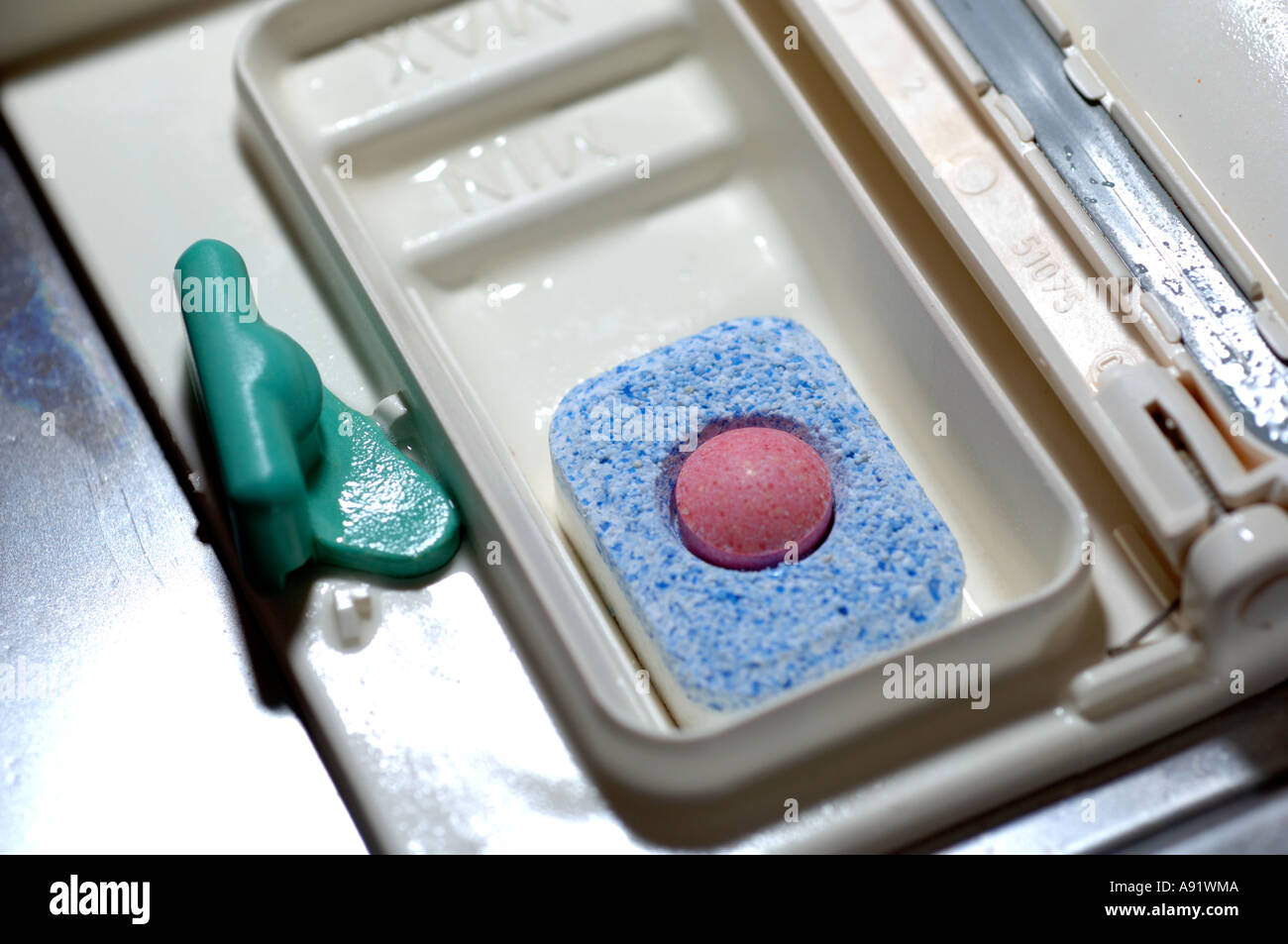 Dishwasher soap tablet in machine Stock Photo Alamy