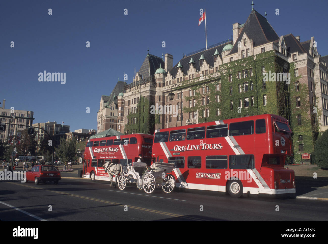 Canada, British Columbia, Victoria Double-decker bus passes the Empress Hotel Stock Photo