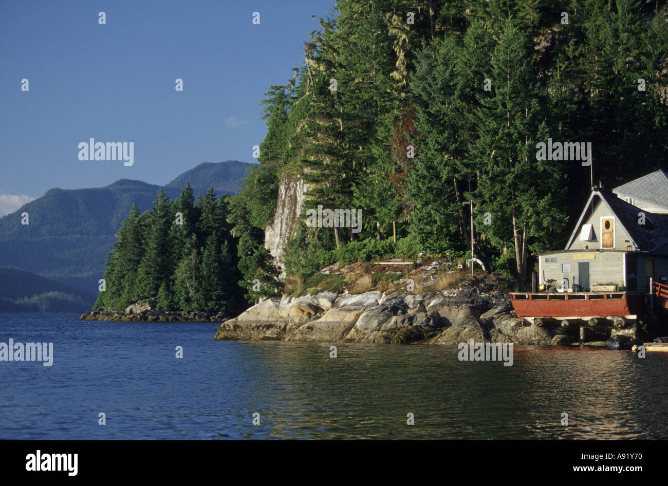 Canada, Gilford Island, Echo Bay, house on the rock wall at Echo Bay