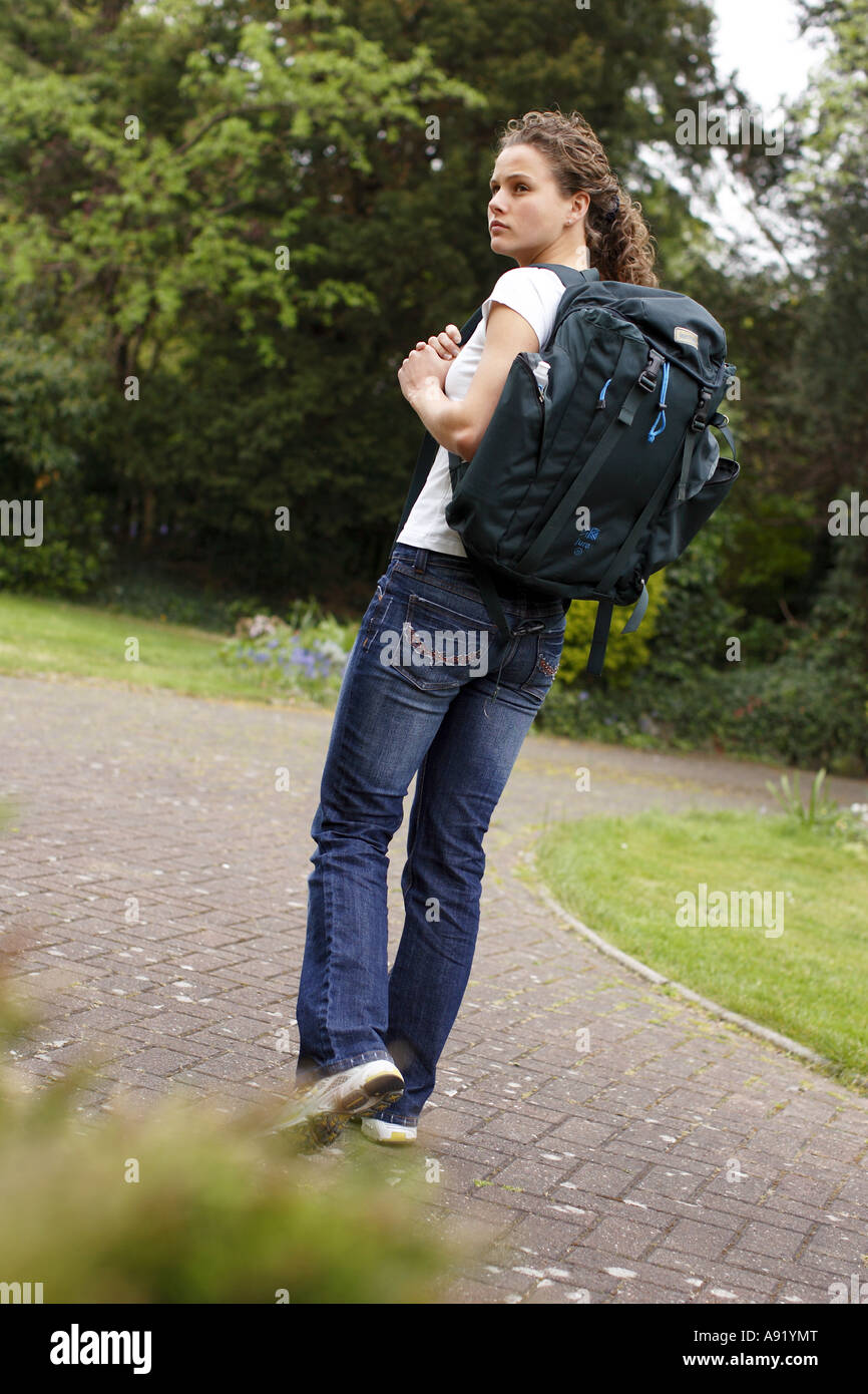 Walk With Rucksack girl with rucksack on her back walking down path Stock Photo - Alamy