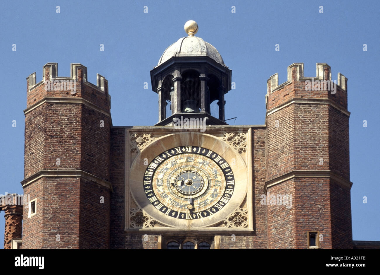 Historical Hampton Court Royal Palace close up of astronomical clock top of Anne Boleyn's Gate Tudor gatehouse Richmond on Thames London England UK Stock Photo