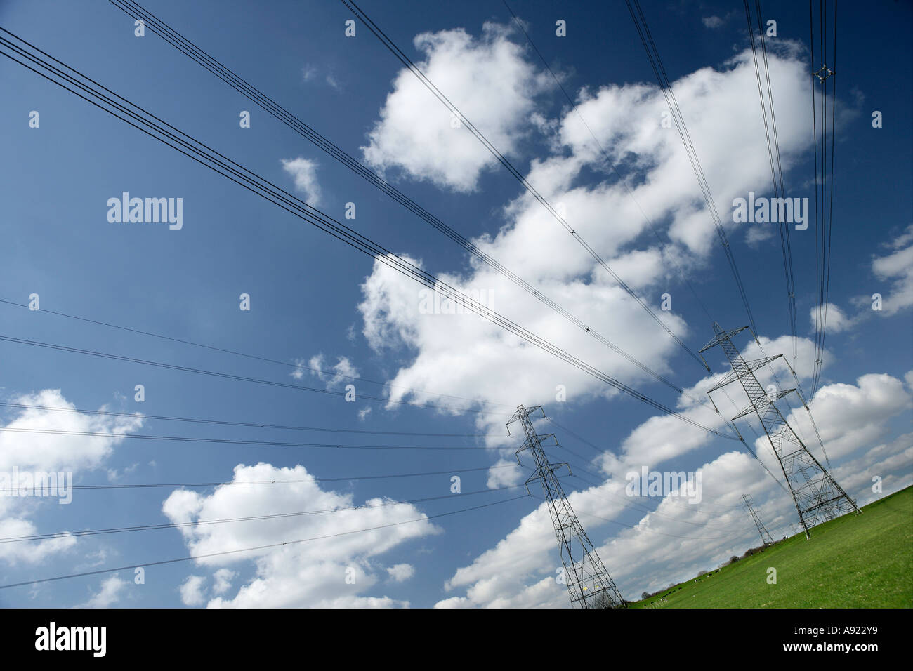 Blue Sky Clouds and Electrical Pylons Stock Photo - Alamy
