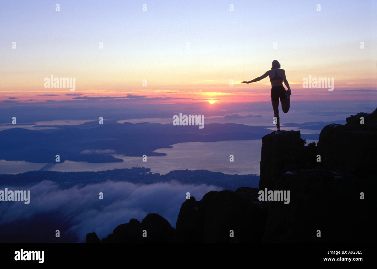 One woman mountain top height hi-res stock photography and images - Alamy