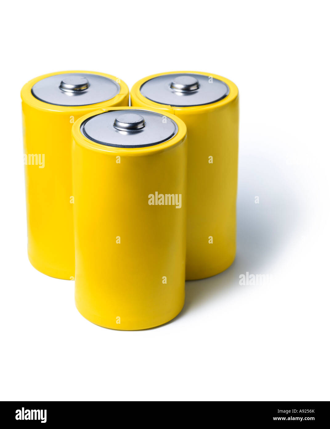 three yellow batteries Stock Photo
