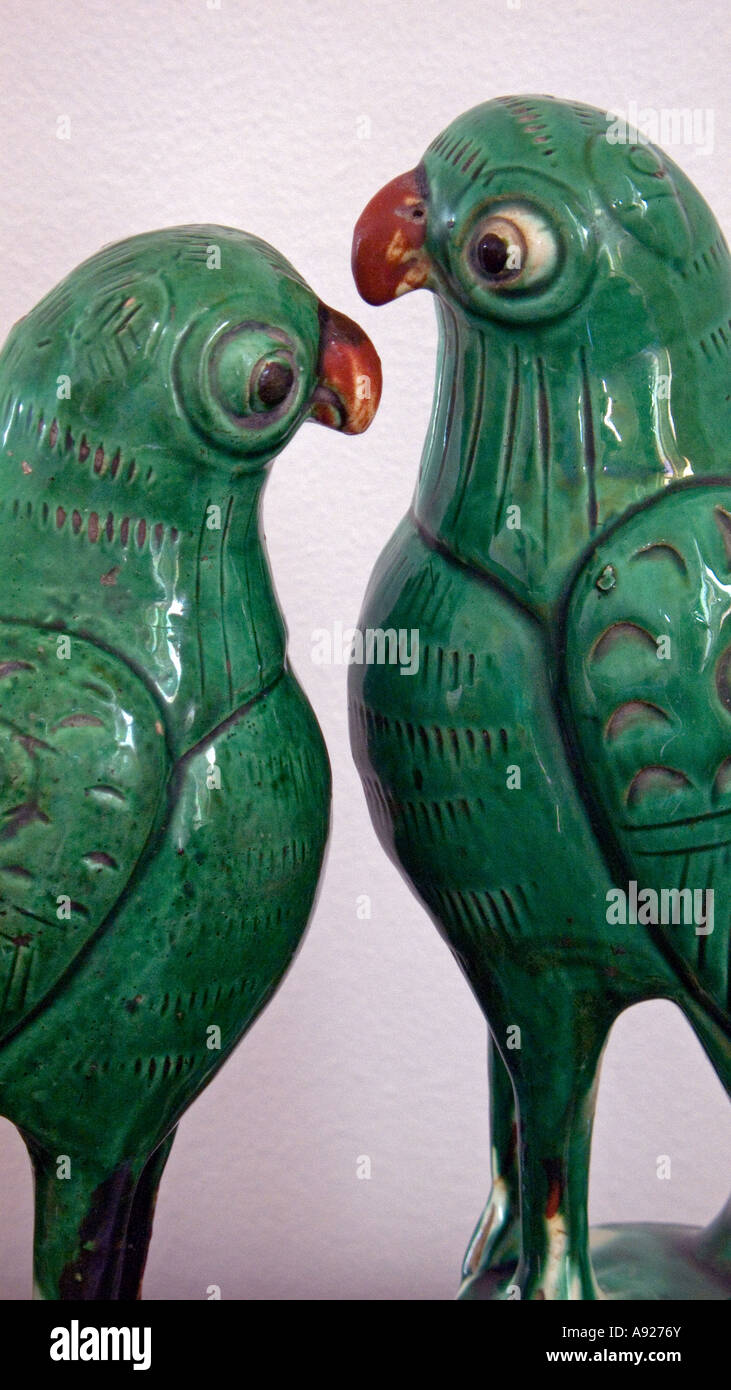 Chinese incense holders in the shape of parrots painted terracotta 19th century Stock Photo