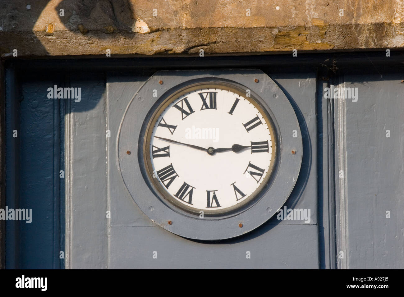 Clock inset in front door Stock Photo